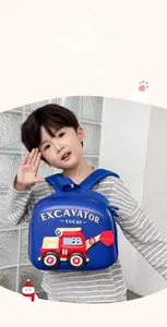 Side view of boy wearing deep blue excavator backpack with hard shell and red relief