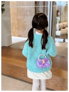 Detailed view of purple sequin girls bag with Rapunzel princess doll and pearl handle