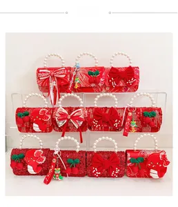 Detail of red festive kid handbags with pearls, sequins and embroidery for Lunar New Year
