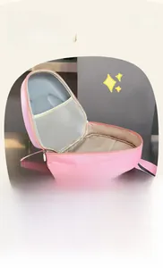 Detail of pink toddler backpack showing interior mesh pocket and multi-layer storage compartments