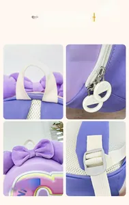 Detail of toddler backpack showing handle, zipper, bow, and adjustable straps