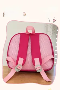 Detail of breathable honeycomb mesh back panel and adjustable straps on kids pink backpack