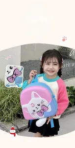 Detail of cartoon cat backpack showing interactive glowing bow and 3D ears