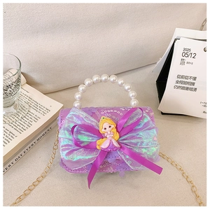 Detail of sequin girl's bag with Rapunzel princess doll, bow and pearl handle