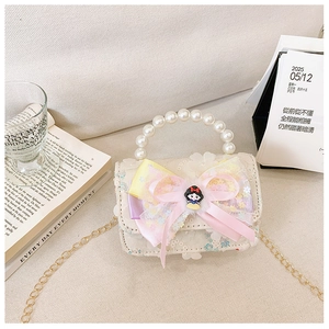 Detail of girls princess bag with pearl handle and bow featuring Snow White ornament