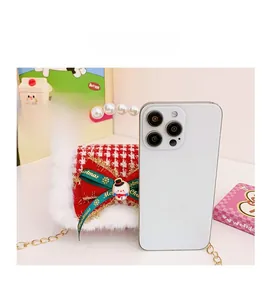 Compact red houndstooth Christmas mini bag with pearl handle shown next to a smartphone