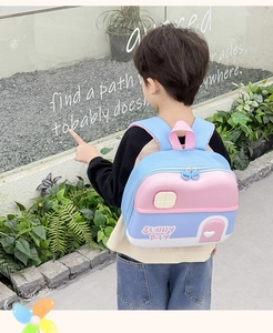 Detailed back view of kids cartoon house-shaped backpack in blue and pink pastel colors