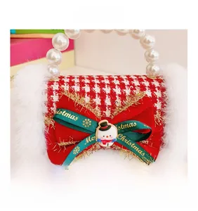 Detail of red houndstooth Christmas handbag with pearl handle, snowman and fur trim