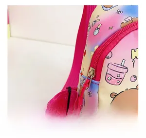 Detailed close-up of smooth pink metal zipper and colorful gradient nylon fabric pattern