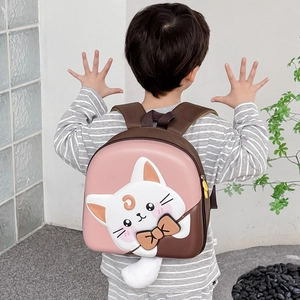 Pink cartoon cat backpack for kids with 3D ears and plush tail on child model
