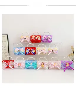 Detail of lace mini bag with pearl handle and bow featuring cartoon character charm