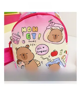 Close-up of pink gradient kids crossbody bag with cute bear and dessert illustrations