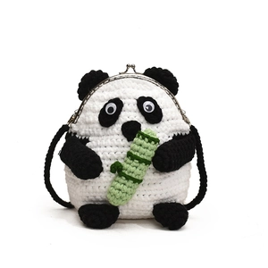 Handmade crochet panda crossbody bag with bamboo detail and vintage metal kiss-lock closure