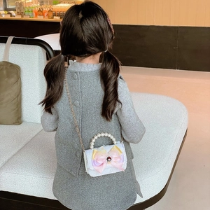 Kids quilted crossbody bag with pearl handle and bow featuring princess motif
