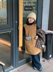 Detail of girls brown teddy fleece vest dress with soft plush texture for winter style
