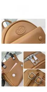 Detaillierte Nahaufnahme des braunen PU-Lederrucksacks mit Metallreißverschluss und Schnalle