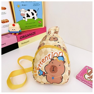 Detail showing checkered capybara chest bag with yellow strap and attention print