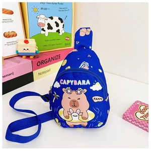 Detailed view of blue kids Capybara sling bag with colorful prints and adjustable strap