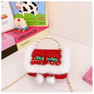 Detail of red tweed Christmas bag with pearl handle and Merry Christmas ribbon bow