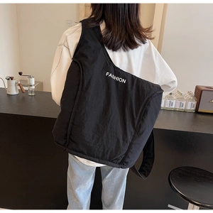 Close-up of a large black casual crossbody bag with white FASHION text and wide strap