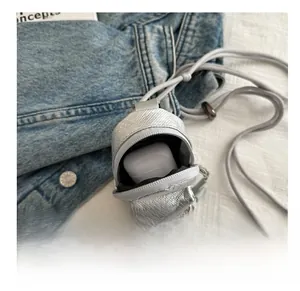 Silver mini earphone case showing storage capacity for wireless earbuds with zipper