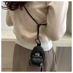 Close-up of black mini headphone pouch featuring a hanging strap and fashion logo