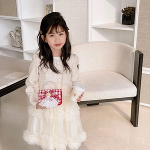Girls red tweed crossbody bag with pearl handle and bow over elegant tulle dress