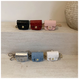 Detailed view of mini quilted chain bags in six colors with decorative gold flower buckles