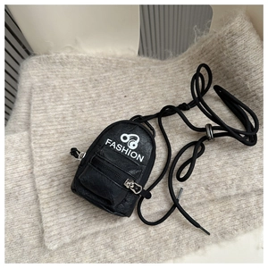 Close-up of black lychee grain mini pouch with FASHION logo and adjustable lanyard