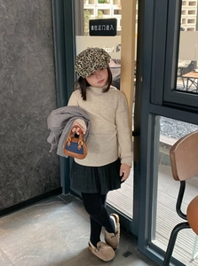 Toddler girl winter outfit featuring leopard print beret and stylish shell handbag detail