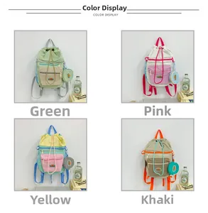 Detail view of large-capacity drawstring backpacks in green, pink, yellow, and khaki colors