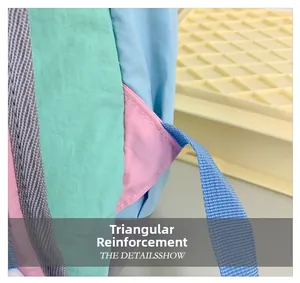 Close-up of triangular reinforcement stitching on kids backpack straps for extra durability