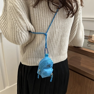 Mini sky blue backpack style headphone bag and lipstick pouch with adjustable neck strap