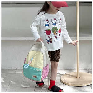 Detailed side view of multi-color kids backpack featuring vibrant patchwork design