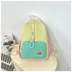 Close-up of color-block backpack featuring blue-pink woven rope zipper pulls