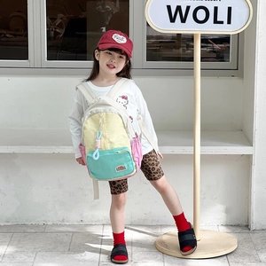 Colorful patchwork canvas backpack for kids featuring large capacity and stylish design