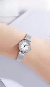 Close-up of GEDI women's watch featuring a silver mesh band and engraved bezel detail