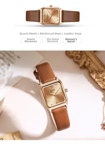 Detailed view of women's rectangular quartz watch with brown leather strap and rose gold case