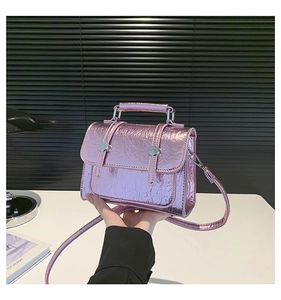 Close-up of lavender metallic wrinkled leather mini bag with silver buckles