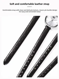 Detail of soft black lychee texture leather strap with adjustable silver pin buckle