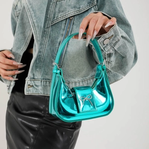 Glossy metallic green mini handbag with bow detail and sleek crescent design