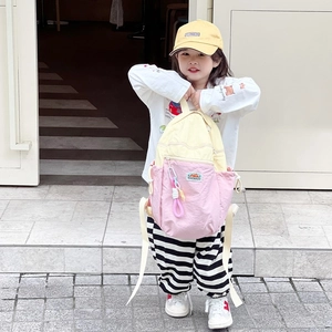 Kids color-block backpack in yellow and pink with logo patch and decorative buckle
