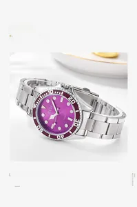 Detail of a purple sunray dial quartz watch with silver steel band on a luxury tray