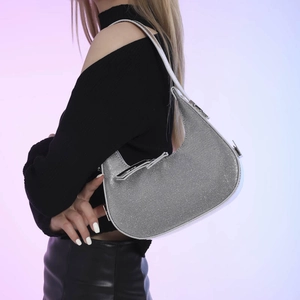 Silver rhinestone crescent shoulder bag with metallic finish for fashion commute