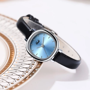 Minimalist women's quartz watch with light blue sunray dial and black leather strap