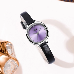 Elegant women's quartz watch with purple sunray dial and black leather strap on white background