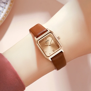 Elegant women's rectangular rose gold watch with brown leather strap and sunray dial