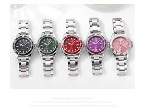 Row of five quartz dive watches in black, green, red, purple, and pink on white background