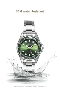 Close-up of green quartz diver watch with splashing water showing 3ATM water resistance