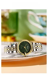 Macro detail of Gedi quartz watch with green dial and gold-silver stainless steel strap
